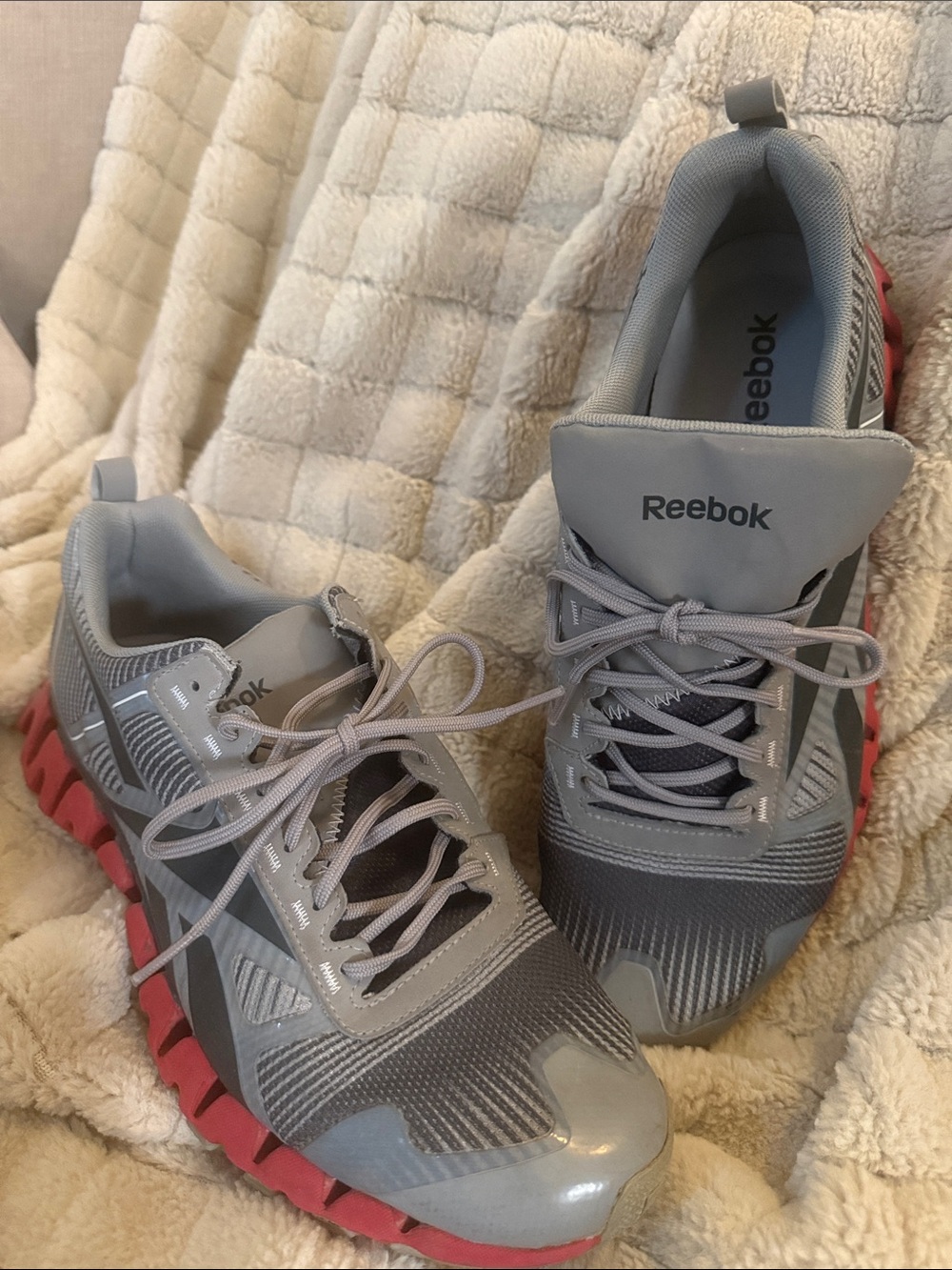 Reebok Men's Gray Athletic Shoes with Red Outsole